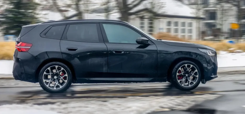 Side profile of a black BMW SUV.