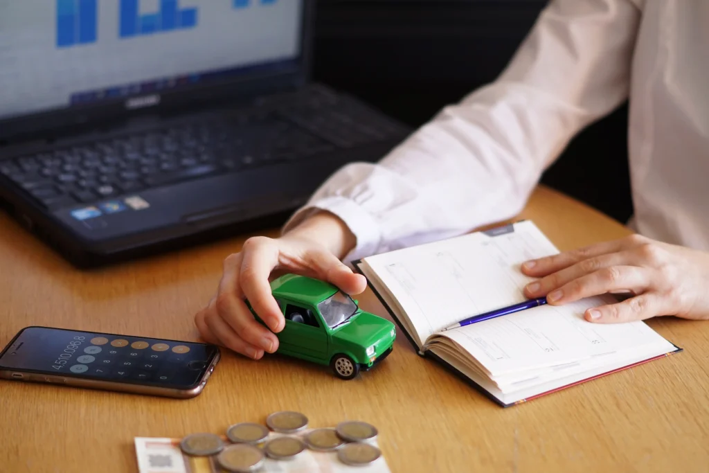 Vehicle owner analyzing costs, fees, and No Claim Bonus savings before switching car insurance companies in Bangladesh