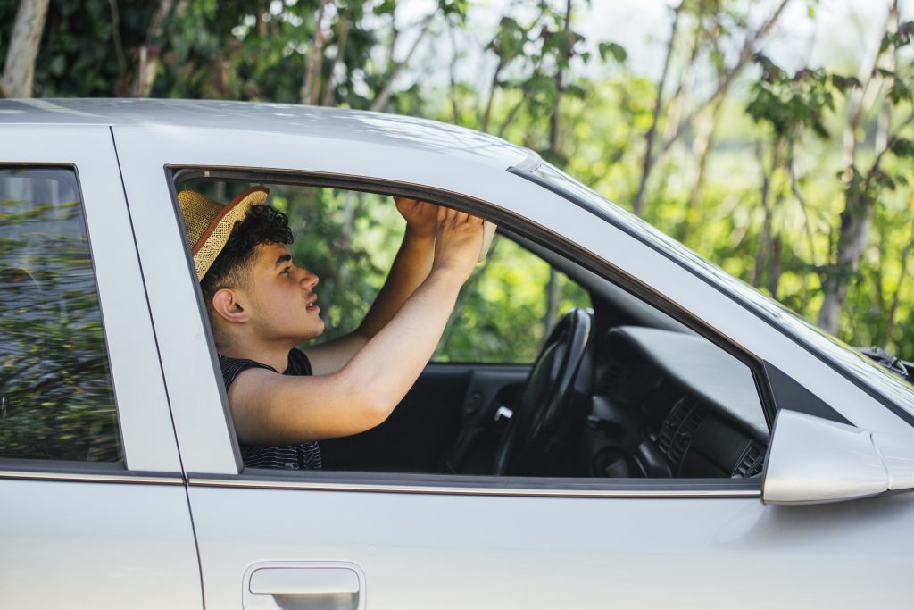Keeping a car window slightly open to safely improve ventilation while resting