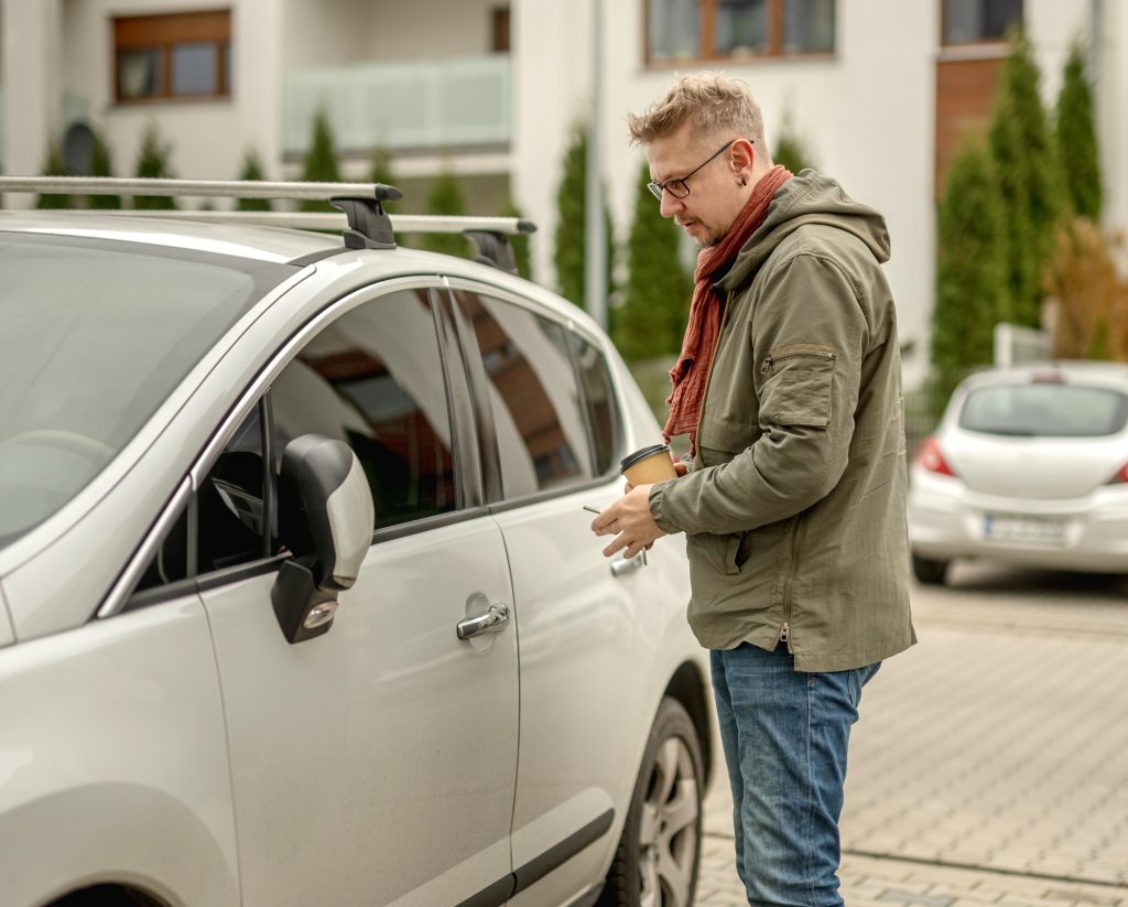 Driver choosing a safe and legal place to park before sleeping in a car.